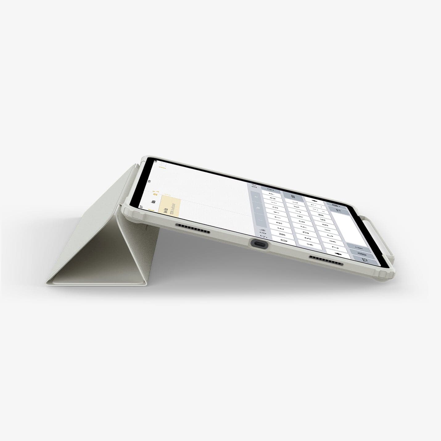 ACS06076 - iPad Pro 12.9" Case Air Skin Pro in gray showing the bottom and partial front with device propped up by built in kickstand