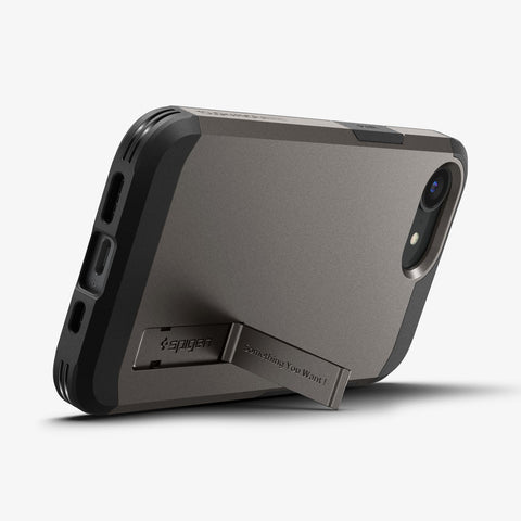 ACS09136 - iPhone 16e Case Tough Armor AI (MagFit) in Gunmetal showing the back, partial side and bottom with built-in kickstand propped up