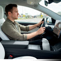 ACP10951 - Tesla Series - Sliding Console Organizer with Bottle Holder | TO220SC showing guy driving with organizer inside console