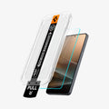 AGL11091 - Galaxy S26 GLAS.tR EZ Fit Pro showing the installation tray hovering above the screen protector and the device
