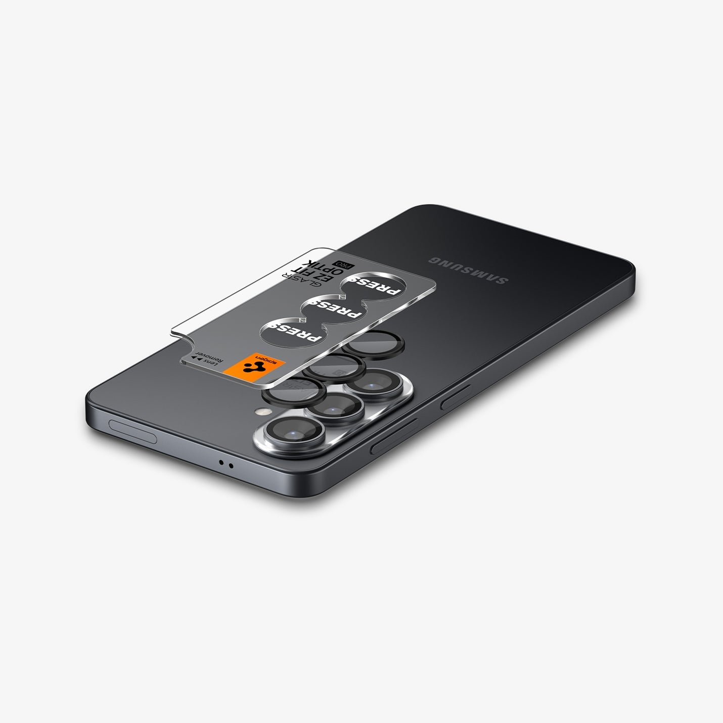 AGL11082 - Galaxy S26 Plus Optik EZ Fit Lens Pro Protector showing the lens protector tray hovering above the lens protector and the device