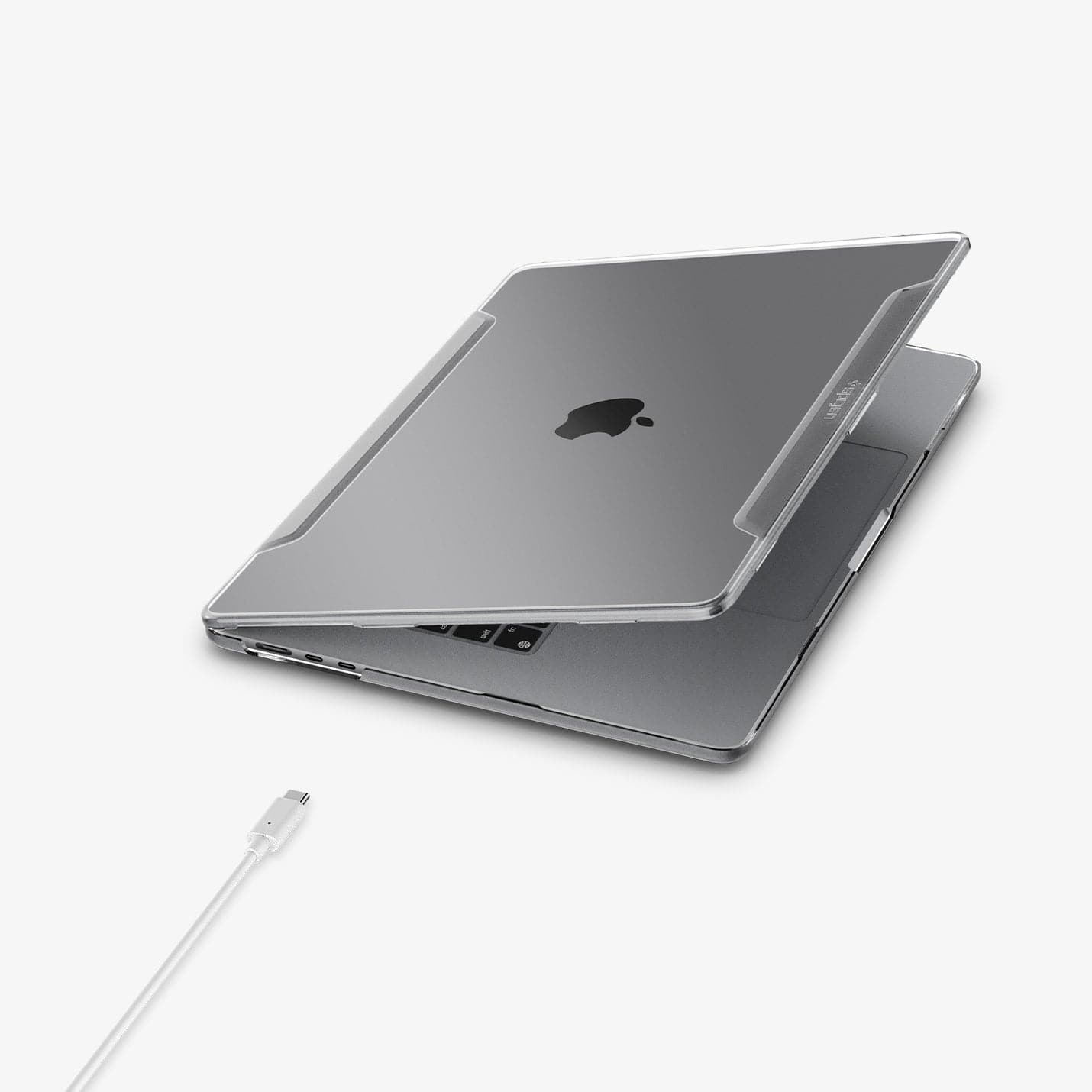 ACS06957 - MacBook Air 15-inch Case Thin Fit in Crystal Clear showing the front and side with laptop slightly open and charging cable next to slot