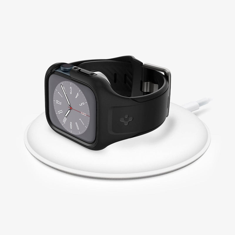 ACS04182 - Apple Watch Series (45mm) Case Liquid Air Pro in black showing the front with watch on wireless charger