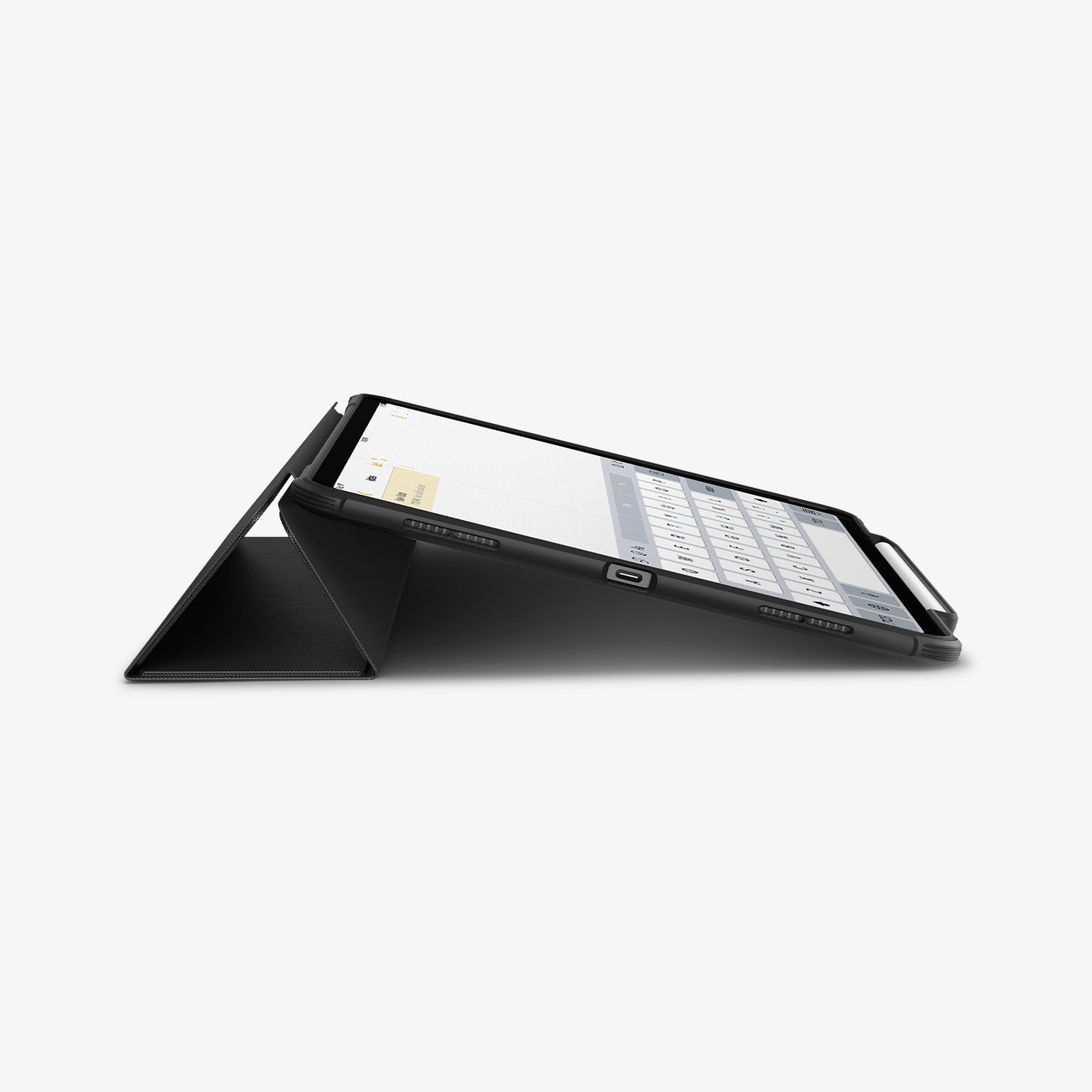 ACS07669 - iPad Air 12.9-inch Case Rugged Armor Pro in Black showing the side, partial front of the device with front cover propped up as a kickstand, and a stylus pen attached