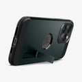 ACS04988 - iPhone 14 Pro Case Tough Armor (MagFit) in abyss green showing the device being propped up horizontally by built in kickstand