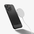 ACS04956 - iPhone 14 Pro Case Rugged Armor (MagFit) in matte black showing the back with magsafe charger hovering away from device