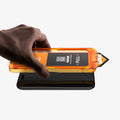 AGL10099 - iPhone 17 Pro Max - Glas.tR AlignMaster S showing screen protector above the device