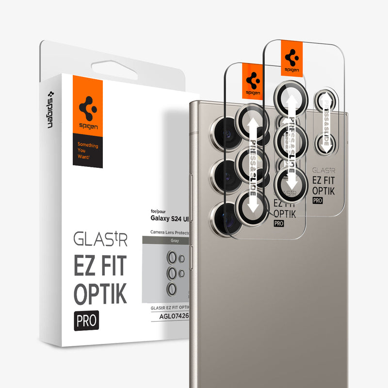 AGL07426 - Galaxy S24 Ultra Optik Pro EZ Fit Lens Protector in Gray showing the camera lens protector hovering above another lens protector tray and device showing back, behind it, is the packaging
