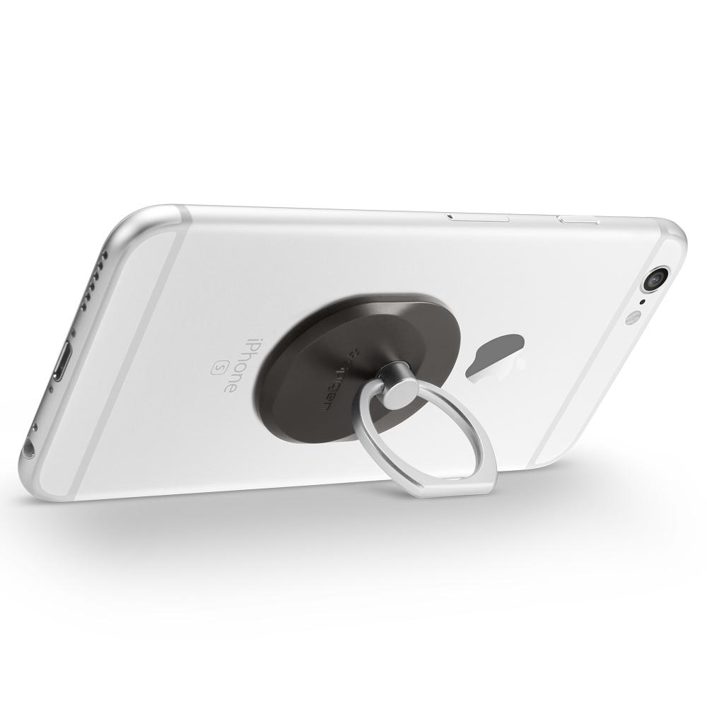 Style Ring in gunmetal shown attached to phone used as kickstand with ring portion pulled out