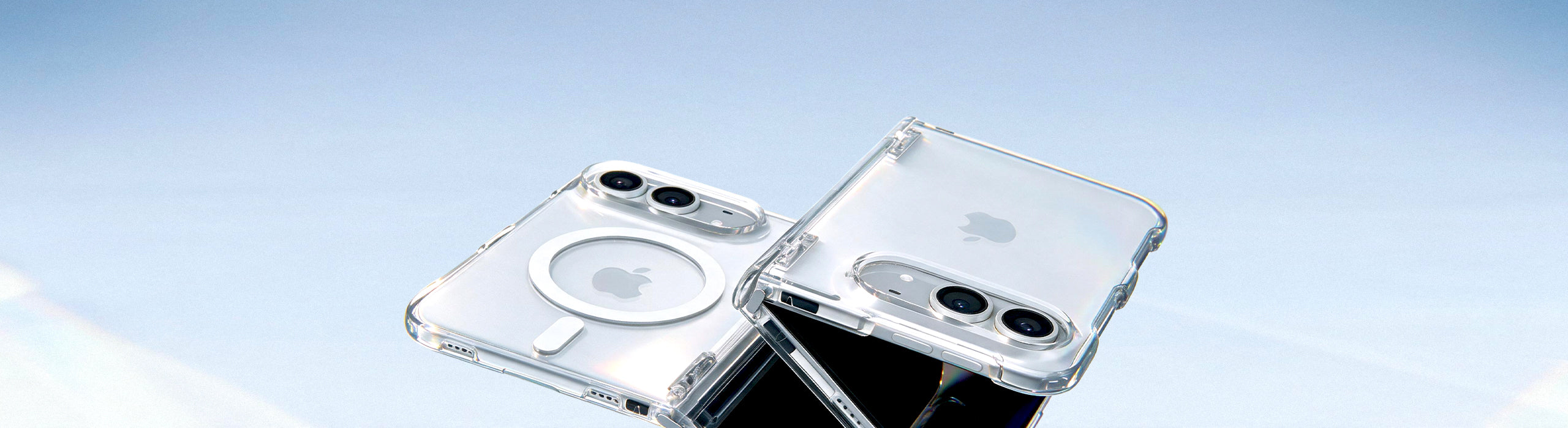 Two iPhone Ultra in clear Spigen cases with MagSafe ring, crossed against a blue background